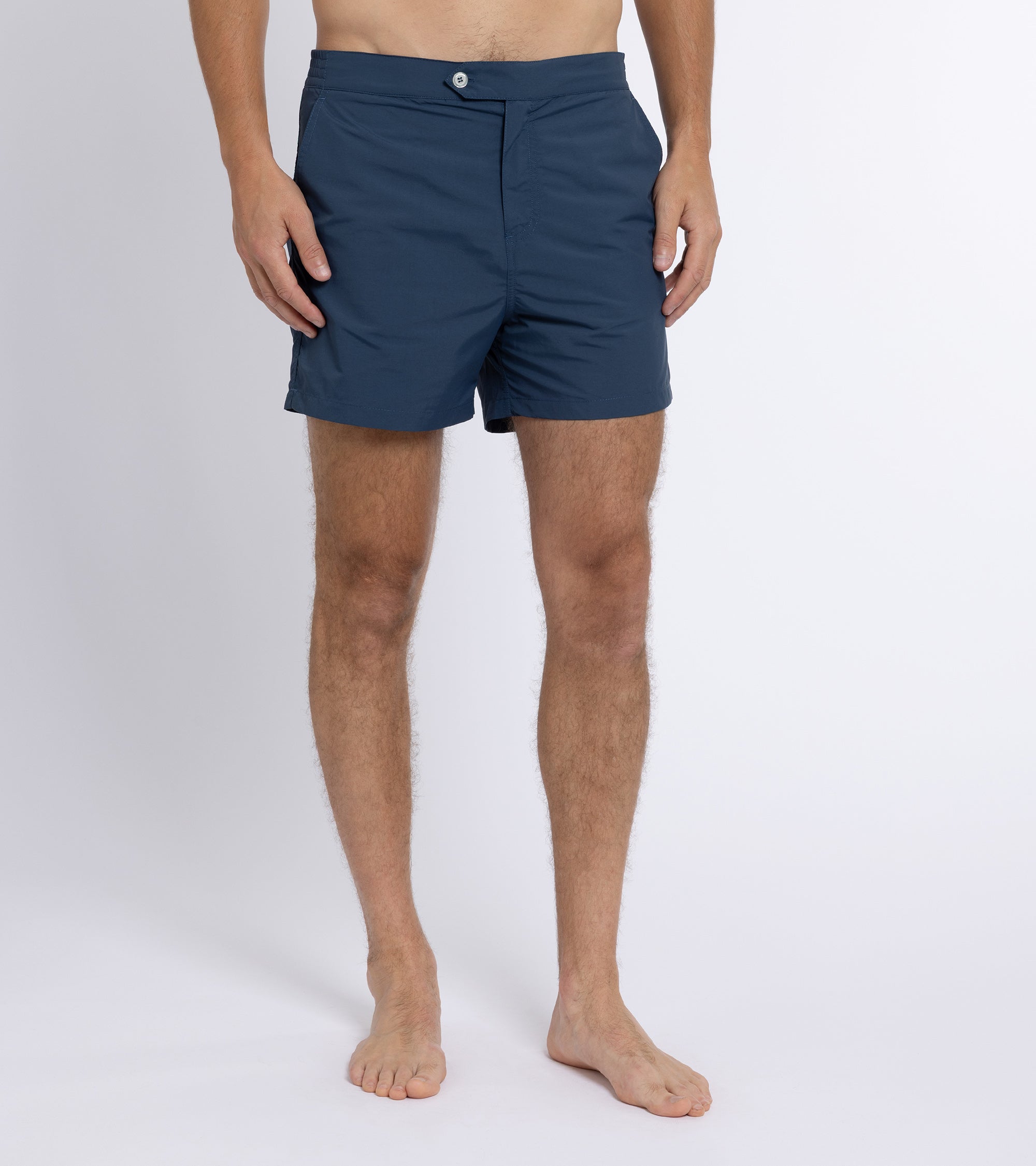 Trunk Foley swim shorts in navy, styled shot.