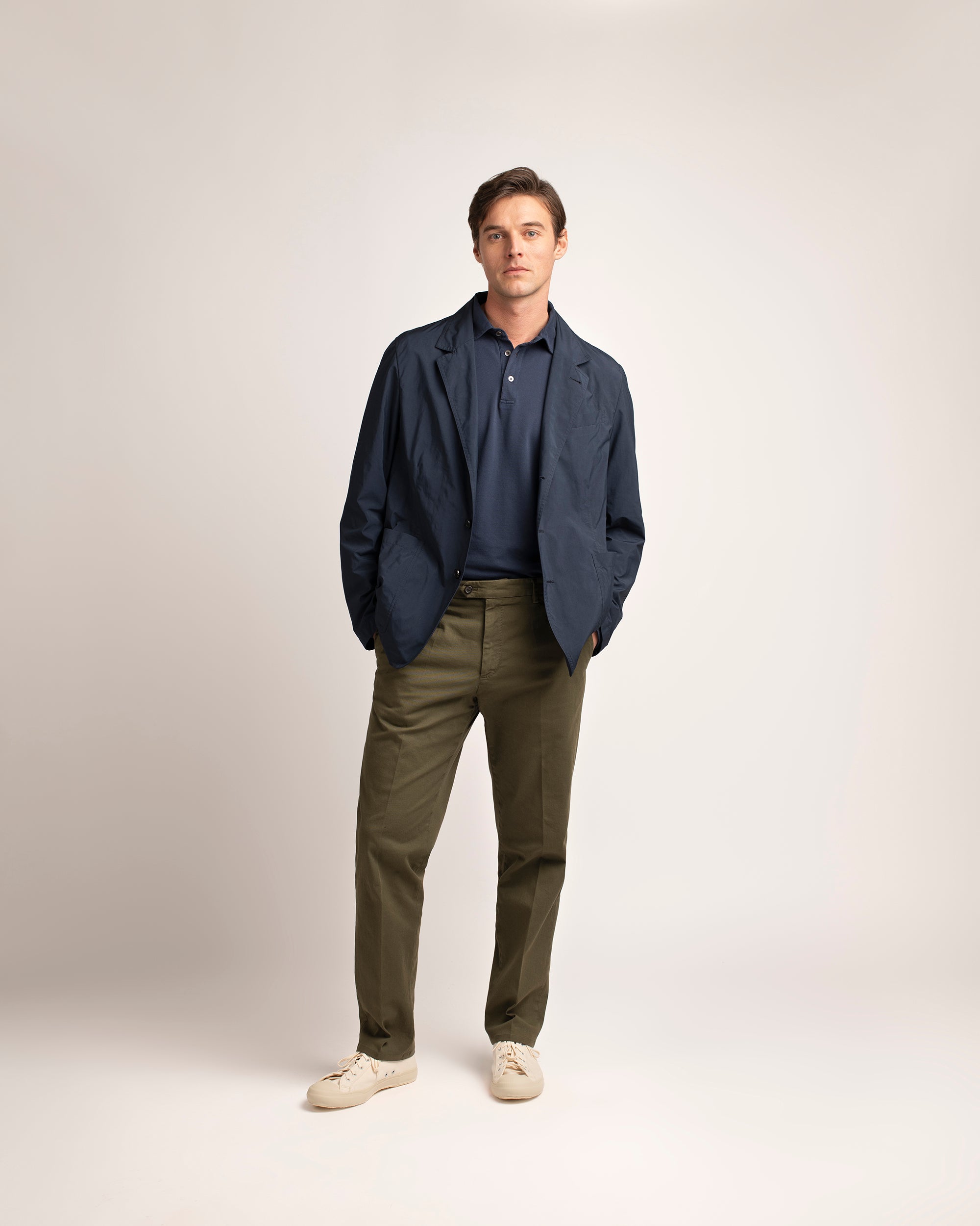 Trunk Palmer flat front trousers in olive, styled shot.